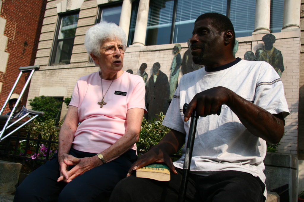 Sr. Marcella pictured with a Christ House patient in 2009
